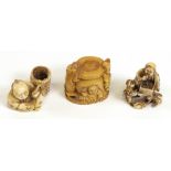 A group of three ivory netsuke, 19th/20th century, comprising, a man seated beside a basket,