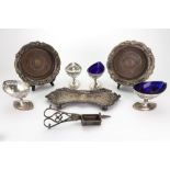 An Old Sheffield plate snuffers tray, of shaped outline, foliate chased around a central crest,