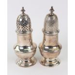 Two George II silver casters, Samuel Wood, London 1741 & 1742, vase form, with bell finials,