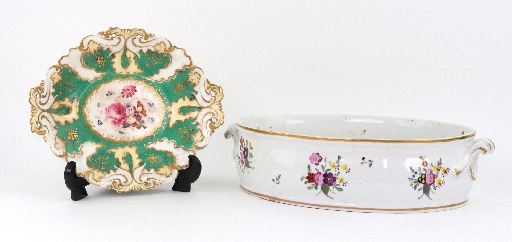 An English porcelain oval dish, early 19th century, painted around the sides with flowers,