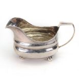 A large George III silver helmet shape milk jug, marks rubbed, circa 1810,