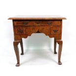 An early 18th century walnut and crossbanded lowboy,