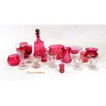 A collection of Victorian and later cranberry glasswares, including six drinking glasses,