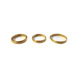 Three 22ct yellow gold wedding bands, London 1961, London 1881 and Birmingham 1926, (inscribed), 11.