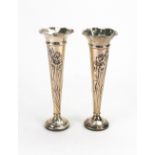A pair of Art Nouveau silver spill vases, H Matthews, Birmingham 1904 & 1905, of trumpet shape,