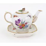 A Copenhagen porcelain ogee silver shape teapot and stand, 19th century, painted with flowers,