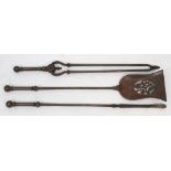 A set of three Victorian steel fire tools, with turned cylindrical stems and spherical finials,