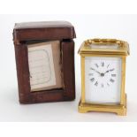 A brass cased carriage timepiece, the white enamel dial with Roman numerals, 14cm high,