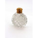 A Dutch gold mounted cut glass perfume bottle, 19th century, circular, hobnail and diamond cut,