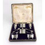 A cased George III style silver double cruet set, Edward John Haseler & C B, Chester 1921 & 1922,