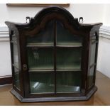 A small Dutch 18th century style mahogany wall hanging cabinet, incorporating earlier elements,