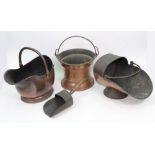 Two Victorian copper helmet coal scuttles,