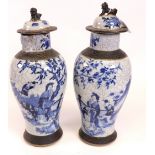 A pair of Chinese blue and white crackleglaze baluster vases and covers, late 19th century,