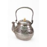 A Chinese teapot, late 19th century, bulbous circular form with hinged overhead handle,