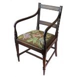 A George III mahogany ebony strung open arm elbow chair, with bar back, drop in needlework seat,