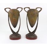 A pair of French Art Nouveau gilt metal polychrome decorated two-handled vases,