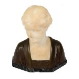 Schumaches: An Art Nouveau alabaster and bronze bust of a young woman,