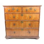 A William & Mary walnut and crossbanded chest, the moulded quarter veneered top,