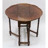 A reproduction late 17th century style walnut Sutherland table,