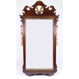 A 'Chippendale' revival upright wall mirror, in mahogany and carved giltwood fret carved frame,