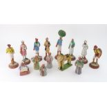 A set of eight Indian painted terracotta figures, 13 - 17cm high,