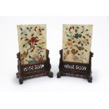 A pair of Chinese rectangular hardstone panels, early 20th century, inlaid with flowers and rocks,