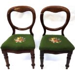 A pair of Victorian mahogany balloon back campaign dining chairs,