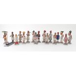 A set of eighteen Indian carved and polychrome painted wooden figures,