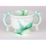 A Royal Doulton Chinese Jade two-handled cup by Charles Noke,