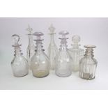 Three early 19th century glass maul shape decanters, with triple ring necks, another,