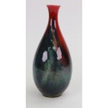 A Royal Doulton Sung flambé bottle vase by Fred Moore, in a thick swirling turquoise,