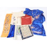 A Chinese blue silk pyjamas embroidered with dragons chasing flaming pearls,