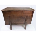 A stained pine dough bin, 19th century, the rectangular lift-off top with moulded sides,