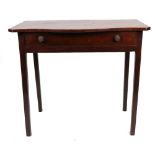 A George III mahogany side table, the serpentine fronted top, above a frieze drawer,