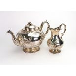 A Victorian silver bulbous circular teapot and matching milk jug, Henry Wilkinson,