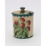 A Wemyss cylindrical preserve jar, painted with strawberries and plums, 11cm high,