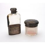 A silver mounted facet cut glass spirits flask, Mappin & Webb, London 1928,