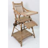 A child's late Victorian beech frame high chair, with splat back and solid seat,