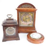 An Edwardian gilt metal mounted oak bracket timepiece, with arched top,