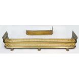 A Regency style pierced brass 'D' shape fender, on claw feet, 120cm wide and a smaller similar,