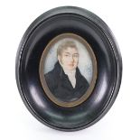 English School, late 18th/early 19th Century, A portrait miniature of a gentleman in a black coat,