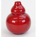 A Bernard Moore flambé glazed vase of compressed double-gourd shape,