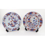 Two Chinese Imari plates, 18th century, painted with flowering trees, 22.