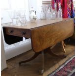 A George IV mahogany breakfast table, with hinged drop leaves, end drawer,