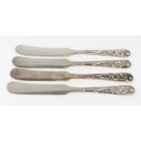 A set of four Chinese silver butter knives, Tackhing and detailed sterling,