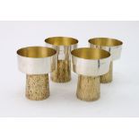 A set of four stylish silver and silver gilt goblets, makers mark GGM, London 1979,