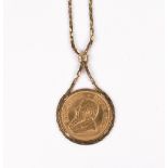 A South African Krugerrand, 1974, set in a pendant, on a 9ct gold fancy link neckchain,