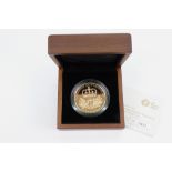 A cased Royal Mint UK 2010 Restoration of the Monarchy £5 Gold Proof coin, 39.9g. Illustrated.