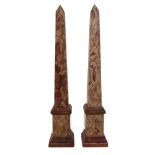 A pair of rouge royal marble obelisks, 19th century, with stepped spreading collars and bases,