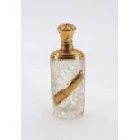 A Dutch gold mounted cut glass perfume bottle, 19th century, of oval section,